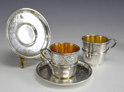 Christofle Pair Silverplate Demitasse Cup and Saucers Gilt interior Circa 1900: Pair of Silver plate Christofle Demitasse Cup and Saucers (2 cups, 2 saucers). Elegant hand engraved designs, gilt wash interior. We currently have several pairs available for purchase separately -