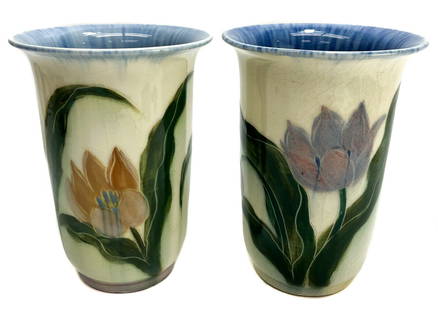 Pair Rookwood Pottery Vases by E.T. Hurley #6806, 1943. Hand Painted Tulips: Pair Rookwood Pottery Vases by E.T. Hurley #6806, 1943. Hand painted orange and purple tulips throughout the exterior with a blue interior. Rookwood mark to the underside base. Weight Approx., 2 lbs M