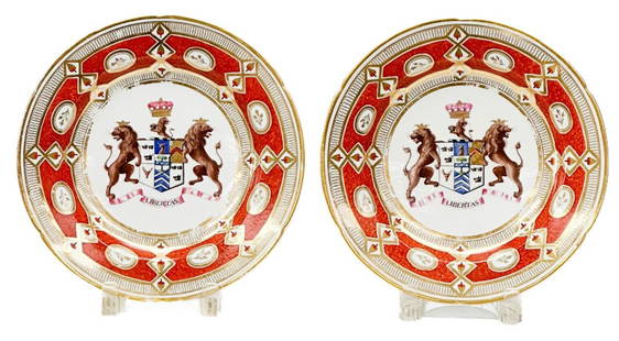 Pair Coalport or Royal Worcester England Porcelain Baron Carbery Armorial Plates: Pair Coalport or Royal Worcester England Hand Painted Porcelain Armorial Plates, circa 1820. A red ground with gilt designs. Hand painted Evans Baron Carbery Coat of Arms to the center featuring lions