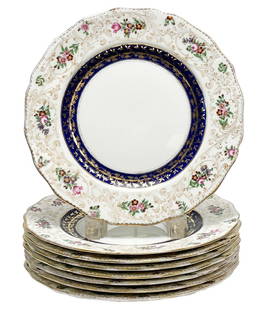 8 Royal Doulton for Tiffany & Co. Hand Painted Porcelain Dessert Plates c. 1910: 8 Royal Doulton for Tiffany & Co. hand painted porcelain dessert plates, circa 1910. A white ground with a band of cobalt blue to the center edge with gilt decoration. Hand painted florals to the