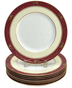 8 Royal Worcester England Porcelain Dinner Plates, 1926. Powdered Burgundy Rim: 8 Royal Worcester England porcelain dinner plates, 1926. A powdered burgundy red ground with a peach inner rim. Multi-colored enamel floral bouquets to the edge. Royal Worcester mark to the underside