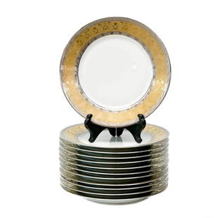 12 Christofle France Gilt & Platinum Banded Porcelain Dessert Plates in La Paiva: 12 Christofle France porcelain dessert plates in La Pavia. A white ground to center, gilt to the edge and with platinum bands to the rim with floral designs. Underside marked Pavillon Christofle La Pa