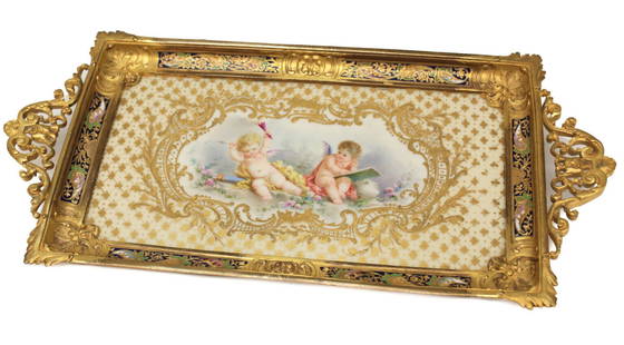 Sevres Porcelain Champleve Desk Tray: Sevres France porcelain and champleve desk tray, 19th Century. Beautiful hand painted cherubs to the center of the porcelain tray with gilt foliate scroll and diamond designs. Gilt bronze champleve de