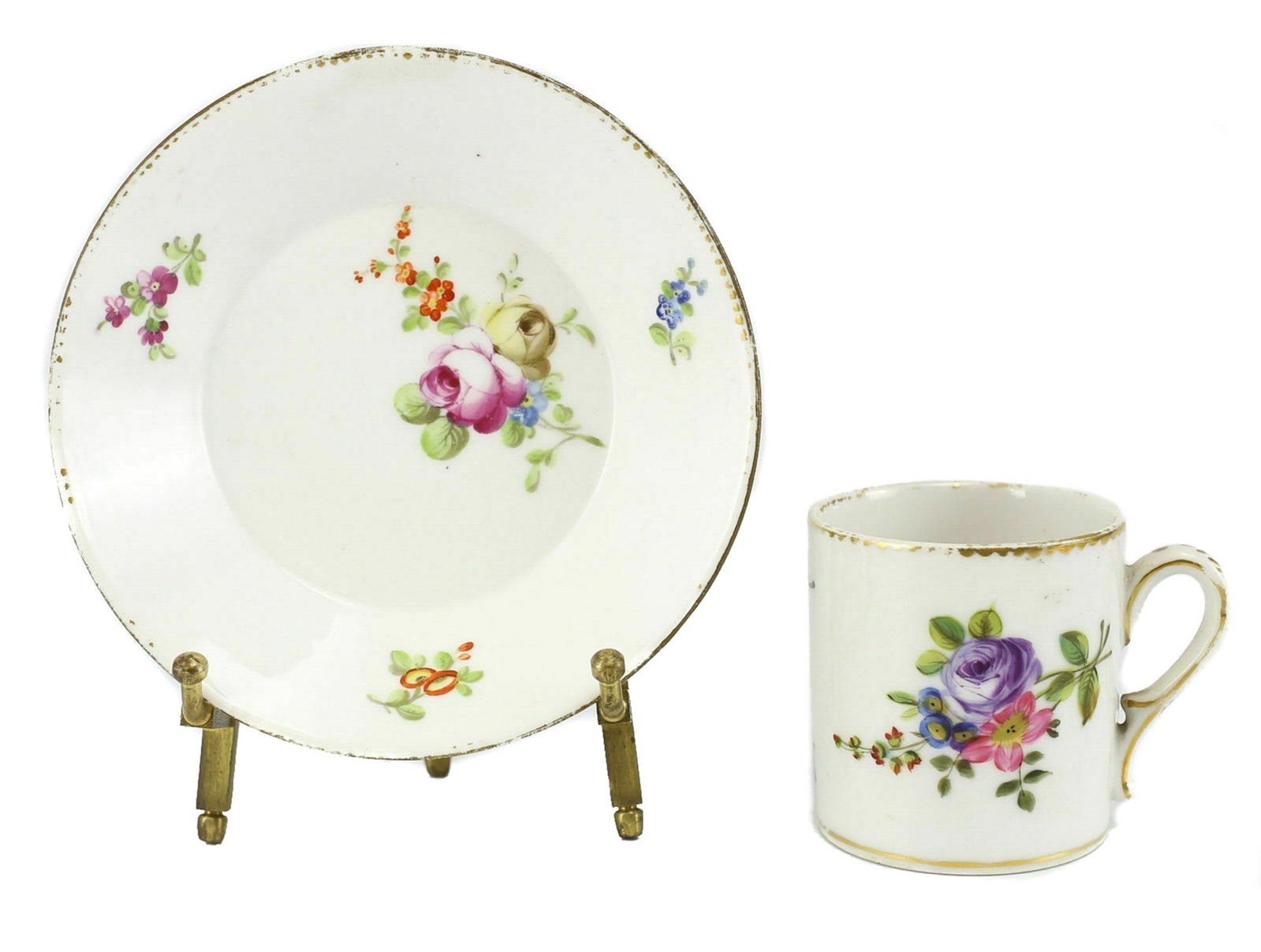 Sevres Porcelain Cup and Saucer, 18th Century: Sevres France hand painted porcelain cup and saucer, eighteenth century. Charming Hand Painted Multicolor Floral Design w / Gilded Rims. Marked for Sèvres. Weight 10oz. Measures approx., Demitasse 2.