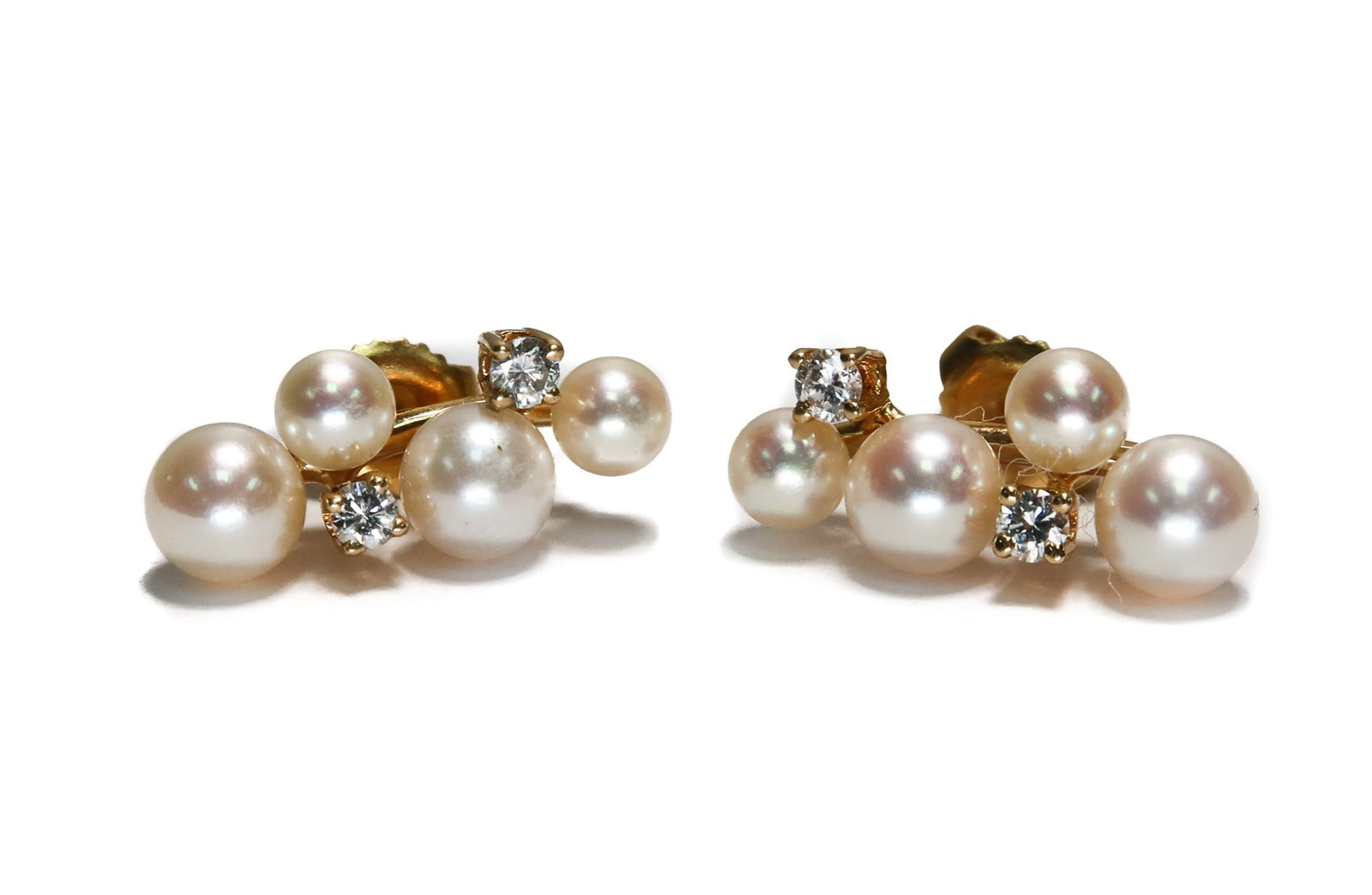 14k Yellow Gold and Cultured Pearl Earrigs: 14k Yellow Gold and Cultured Pearl Earrings. 4 various cultured pearls with 2 brilliant round cut diamonds weighing approximately 0.12 carats total. Marked "14k" to backings. Weight Approx., 3.14 gram