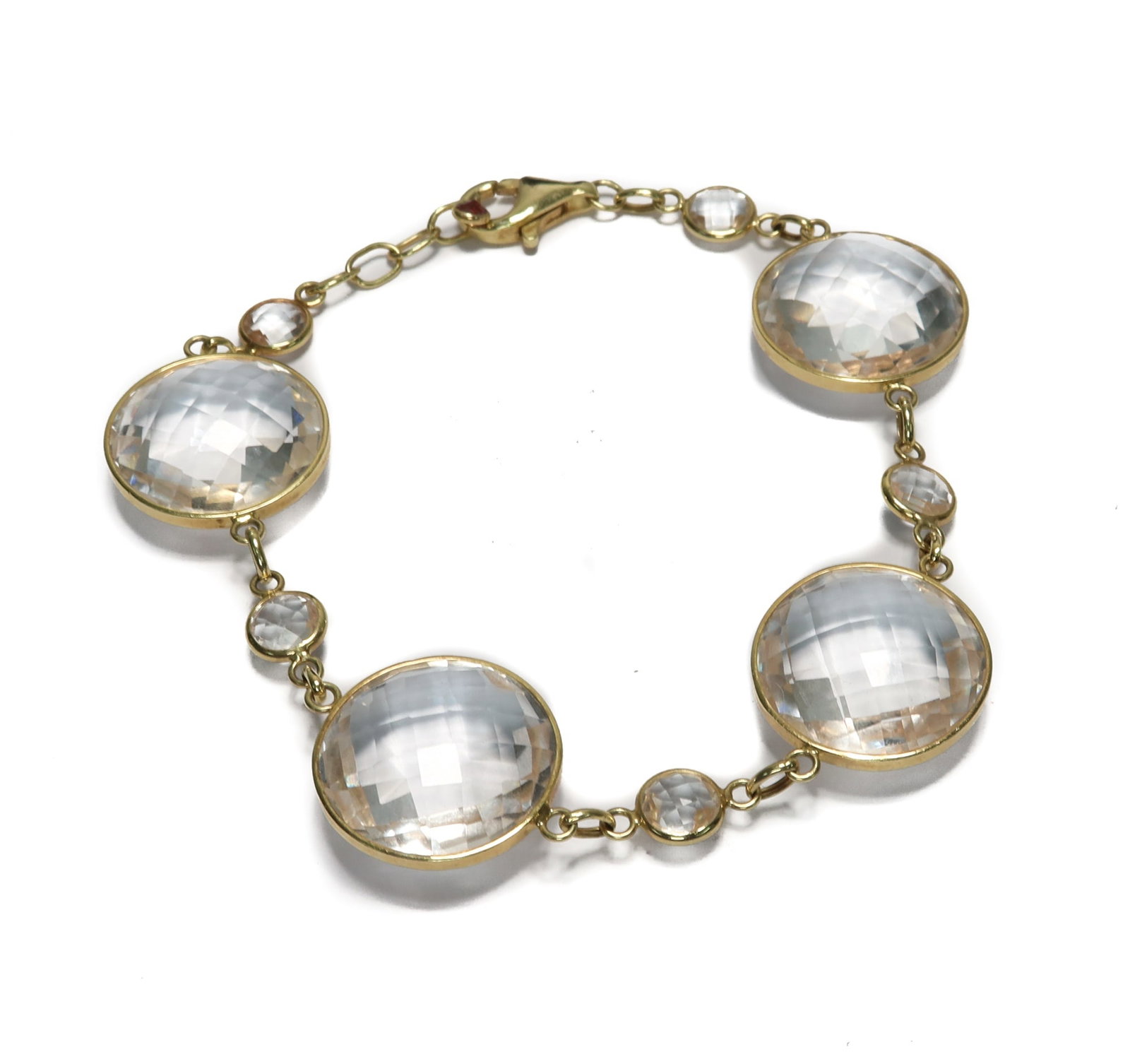 14k Yellow Gold White and Pink Tourmaline Bracelet: 14k Yellow Gold White and Pink Tourmaline Bracelet. 4 large tourmaline jewels with 4 smaller jewels for the spacers. Marked "14k" with a pink tourmaline charm to the end. Weight Approx., 18.4 grams Me