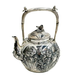 Japanese Sterling Silver Repousse Iris Teapot circa 1900: Japanese Sterling Silver Repousse Iris Teapot, circa 1900. Repousse irises to the body, floral finial. Handle with carved natural joints. Underside with Japanese maker's marks, marked ?? , sterling