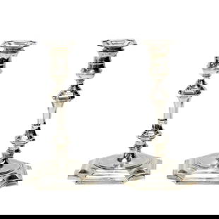 Pair Cartier Sterling Silver Candlestick Holders: Pair Cartier Sterling Silver Candlesticks. Underside marked Cartier Sterling 2633 Cement Filled. Weight Approx., 3.5 lbsMeasures Approx., 5.5 inches x 5.5 inches x 9.75 inches tallDomestic Shipping: