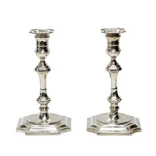 Pair Cartier Sterling Silver Candlestick Holders: Pair Cartier Sterling Silver Candlesticks. Underside marked Cartier Sterling 2633 Cement Filled. Weight Approx., 3.5 lbsMeasures Approx., 5.5 inches x 5.5 inches x 9.75 inches tallDomestic Shipping: