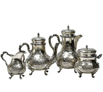 4pc Storck & Sinsheimer Germany Silver Tea & Coffee Set: 4 piece Storck & Sinsheimer Hanau Germany silver tea & coffee set, circa 1900. Set includes teapot, coffee pot, creamer, and a sugar. Repousse floral and foliate decoration framing relief images of