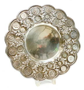 833 Porto Silver Coin Mounted Tray Charger: Large .833 solid silver coin mounted centerpiece or charger, 1st half 20th Century. 32 Portuguese coins inset around the hand chased foliate scroll and scalloped rim. Porto silver hallmark to the edge