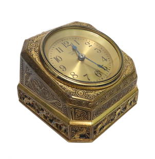 Tiffany & Co. Studios New York Desk Clock in Venetian Pattern: Tiffany & Co. Studios New York Desk Clock in Venetian Pattern. An Italian Renaissance design with hand chased figural tailed animals to the ends. Tiffany & Co. New York mark to face of clock. Weight A
