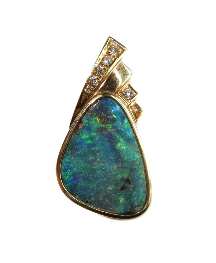 14k Yellow Gold Blue Opal and Diamond Necklace Pendant: 14k Yellow Gold Blue Opal and Diamond Necklace Pendant. Triangular opal center with 5 brilliant round cut diamonds to hook. Marked "585" to backing. Weight Approx., 9.63 grams Measures Approx., 1,25 i