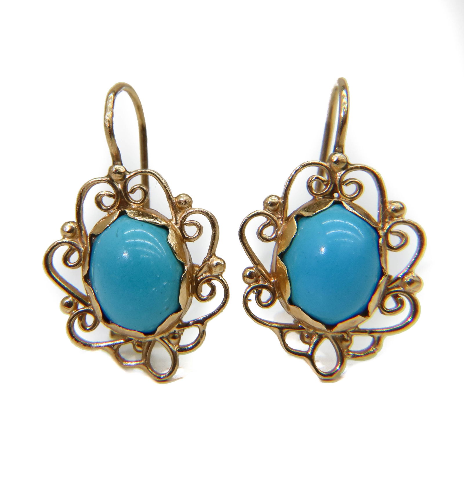 14k Yellow Gold and Blue Turquoise Earrings: 14k Yellow Gold and Blue Turquoise Earrings. Cabochon Tuquoise to center with gold wired frame in a form of flower petals. Marked "14k" to backing. Weight Approx., 3.98 grams Measures Approx., 1 inche