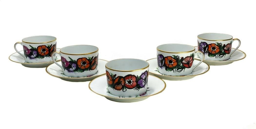 5 Bernardaud Buffet Limoges Large Cup & Saucers in "Les Anemones": 5 Bernardaud Buffet Limoges porcelain large cup and saucers in "Les Anemones". Multi-colored flowers throughout with black outlines. Gilt to the the rims. Signed "B.B." for Bernardaud Buffet with Limo