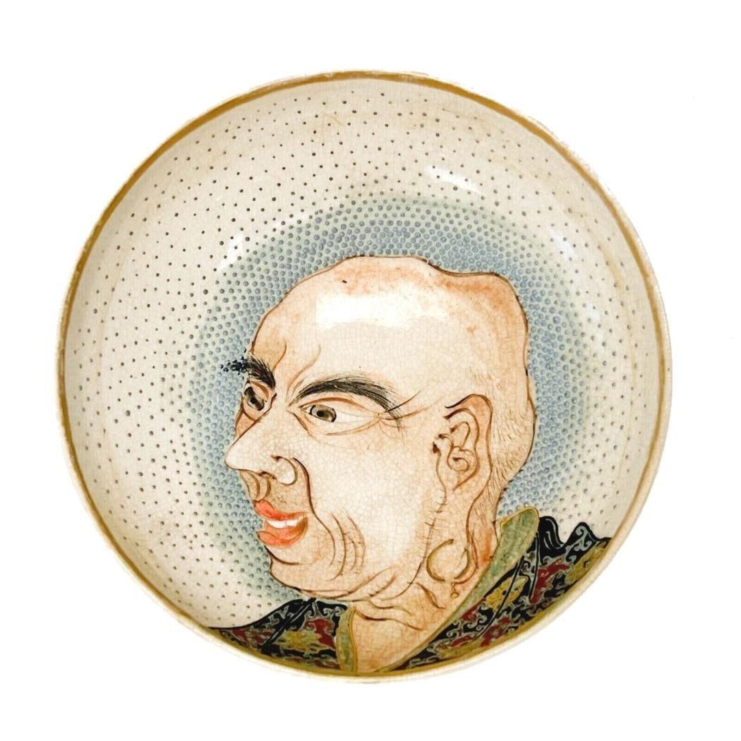 Japanese Satsuma Hand Painted & Enameled Porcelain Bowl Meiji Period: Japanese Satsuma hand painted and enameled porcelain bowl, Meiji period. Bowl decorated with the face of an elderly man to the center, surrounded by raised blue enamel dot decoration in a radiating ef