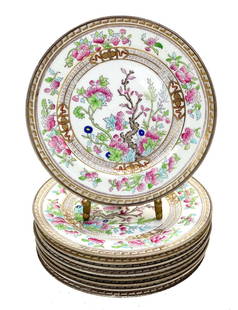 8 Royal Doulton England Porcelain Indian Tree Bread & Butter Plates, circa 1910: 8 Royal Doulton England porcelain Indian Tree bread & butter plates, circa 1910. Gilt key borders to the rim with pink enamel florals and tree branches. Royal Doulton England mark to the underside. We