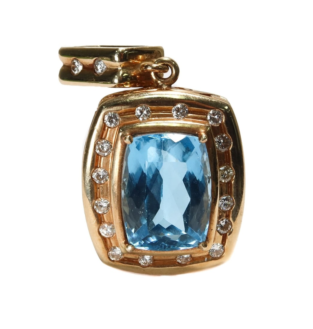 14k Yellow Gold Blue Topaz and Diamond Pendant: 14k Yellow Gold Blue Topaz and Diamond Pendant. Large Rectangular faceted blue topaz center with 18 brilliant round cut diamonds to the frame and hook. The topaz weighing approximately 27.15 carats an