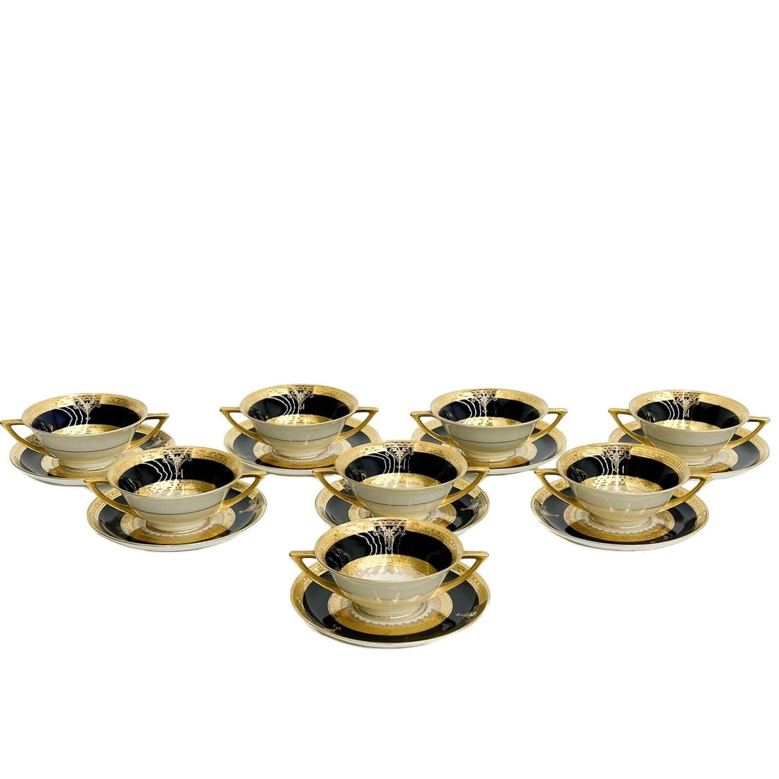 8 Pirkenhammer Czech Czechoslovakia Porcelain Bouillon Bowls & Underplates c1920: 8 Pirkenhammer Czech Czechoslovakia Porcelain Bouillon Bowls and Underplates, circa 1920. A blue ground to the edge, gilt decoration, white enamel flowers. Underside marked Pirkenhammer Czechoslovakia