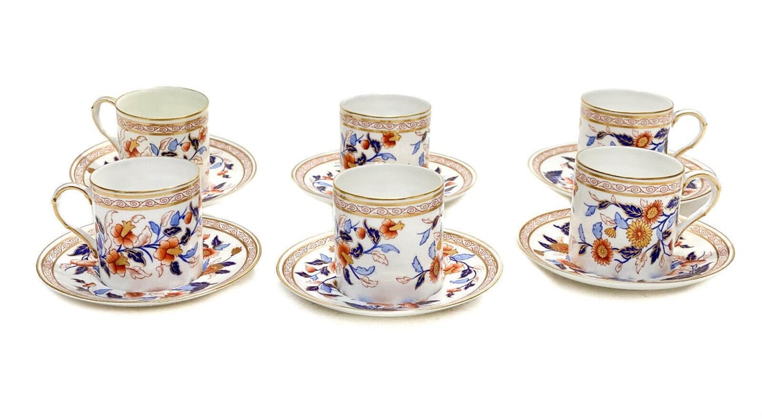 6 Royal Worcester Hand Painted Porcelain Demitasse Cup & Saucers, 1884: 6 Royal Worcester hand painted porcelain demitasse cup and saucers, 1884. Blue and orange flowers to the central area. Royal Worcester mark to the underside. Weight Approx., 4 lbs Measures Approx., Cu
