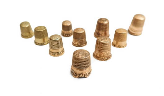 10 English and American Yellow and Rose Gold Thimbles, Etched Florals and Foliate Scrolls: 10 Yellow and Rose Gold Thimbles Etched florals and foliate scrolls to edge. 4 thimbles with English maker marks originating to Birmingham, and 6 American marks including MKO, and Simon Brothers. 