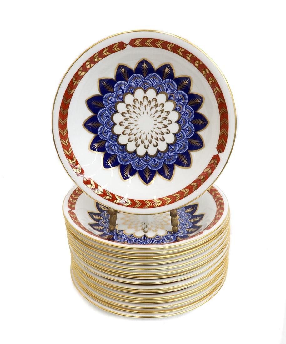 16 Royal Crown Derby England Cereal Berry Dessert Coupe Bowls in Quail, 20th C: 16 Royal Crown Derby England porcelain cereal, berry, or dessert coupe bowls in Quail, Late 20th Century. Rust red and gold feathered rim with a blue and gold blue quail feathered emblem to center. Ro