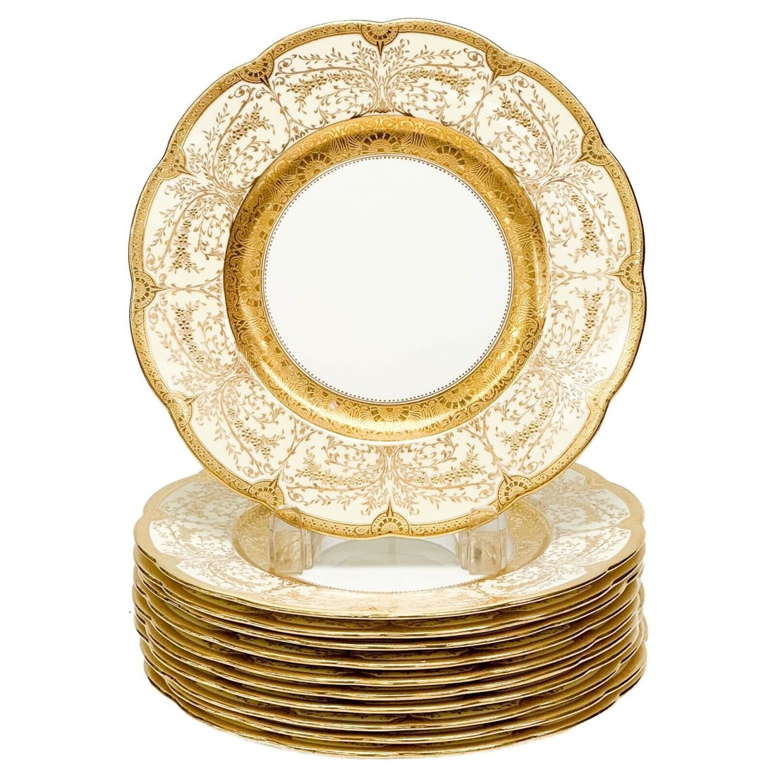 11 Minton England for Tiffany & Co Gilt Porcelain Dessert Plates c 1920: 11 Minton England for Tiffany & Co. Porcelain Dessert Plates, circa 1920. Cream colored plates with ornate gilt floral decoration. Underside with Minton marks for Tiffany & Co. Approximate weight: 9.5