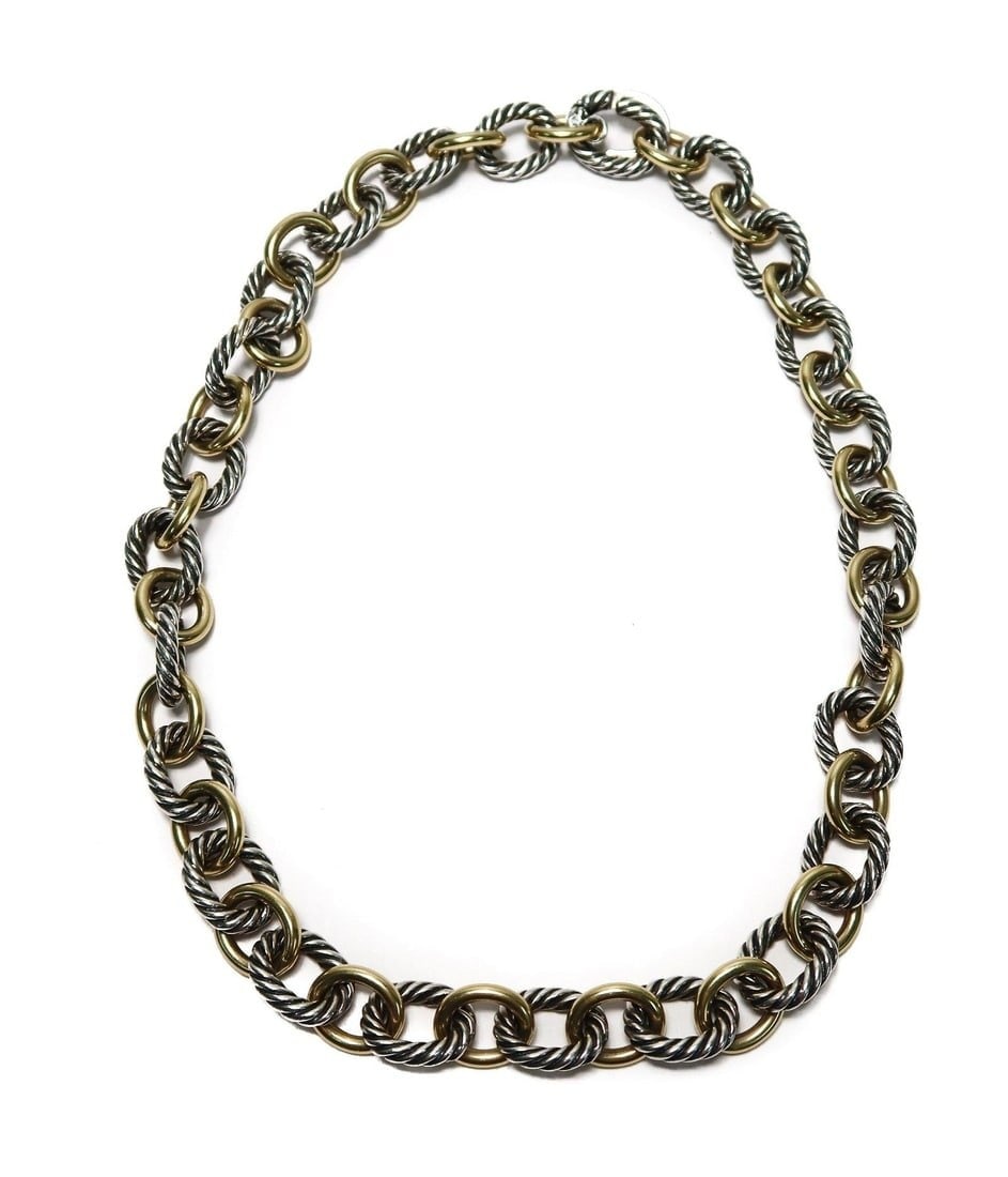 18k Yellow Gold and Sterling Silver Linked Chain Necklace: 18k Yellow Gold and Sterling Silver Linked Chain Necklace. 18k gold links alternating with sterling silver ribbed links. Marked 18k gold and 925 sterling silver to clasp. Weight Approx., 104 grams Mea