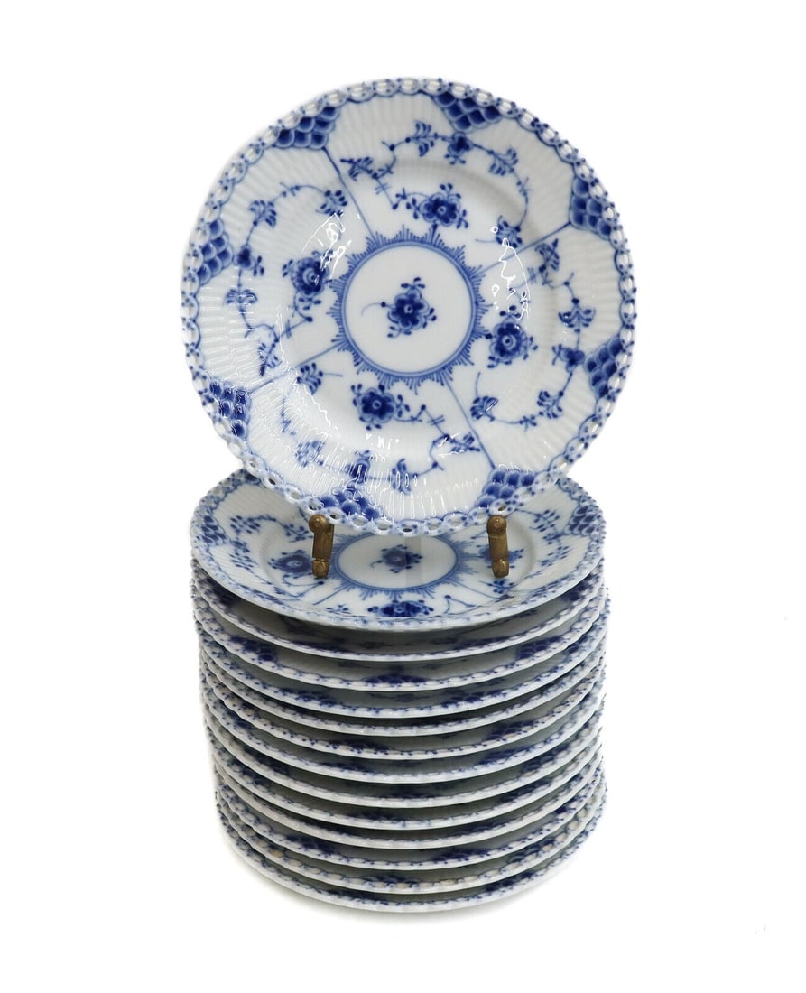 15 Royal Copenhagen Porcelain Blue Fluted Full Lace Bread Plates #1088 1st Qual: 15 Royal Copenhagen Porcelain Blue Fluted Full Lace bread plates #1088. Fluted porcelain with a delicate blue floral design. Full lace border. Royal Copenhagen marks to the underside with date marks r