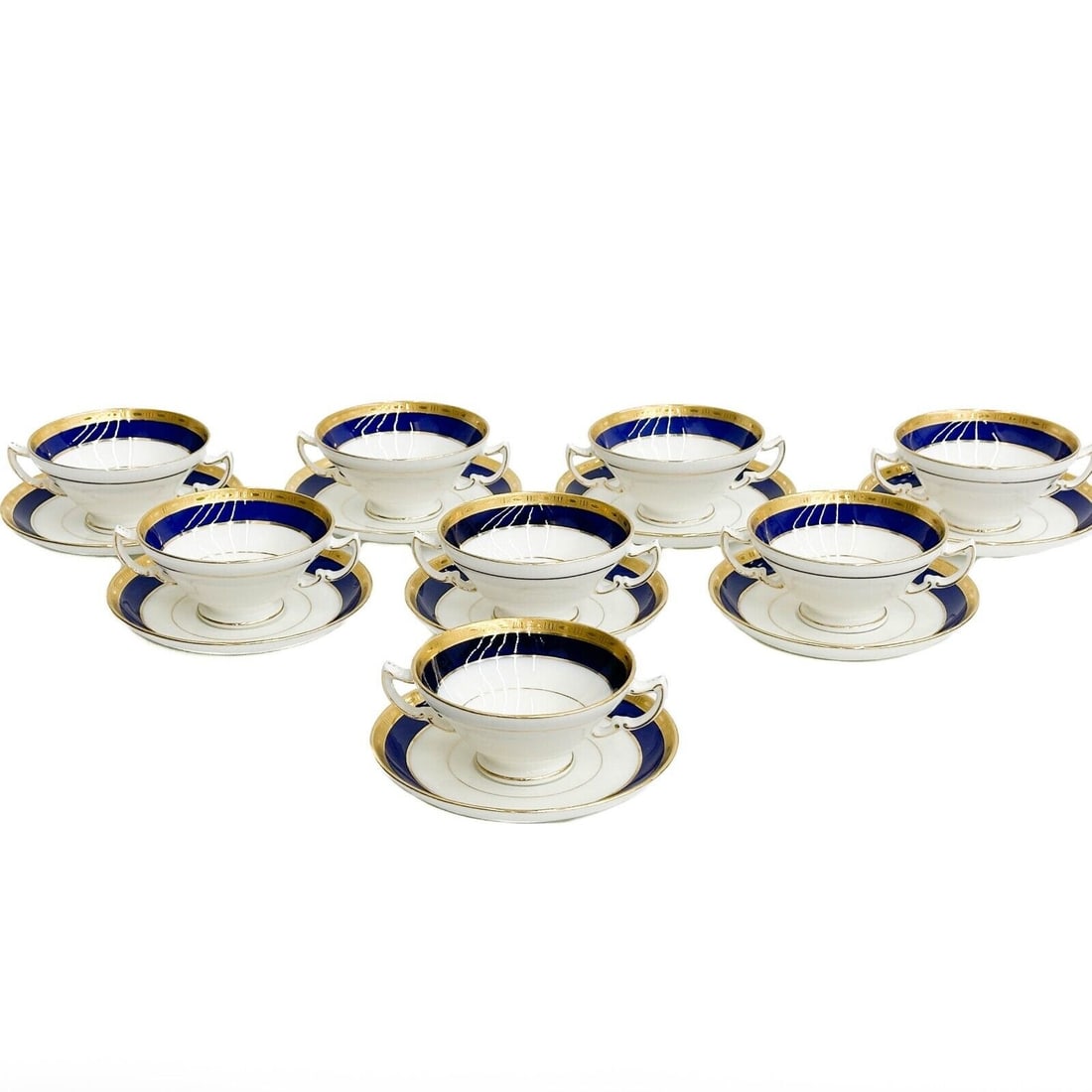 8 Minton England for Tiffany & Co Porcelain Bouillon Bowls and Underplates c1920: 8 Minton England for Tiffany & Co Porcelain Bouillon Bowls and Underplates. A cobalt blue ground to the edge with gilt decoration to the rim. Underside with Minton for Tiffany & Co. marks, Minton impr