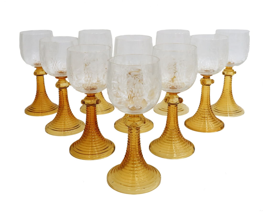 10 Bohemian Amber and Clear Cut Glass Wine Goblets Etched Grapes Prunts c1940: 10 Bohemian amber and clear cut glass wine goblets, circa 1940. Ribbed stem with applied prunts. Etched grapes and leaves to bowl. The base and connector are blown and separately applied. Weight: Appr