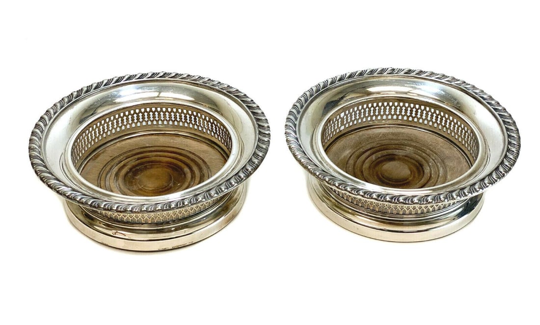 Pair English Lawrence B. Smith L.B.S Co. EPNS Silverplate Wine Bottle Holders: Pair English Lawrence B. Smith L.B.S Co. superfine EPNS silverplate wine bottle holders. Gadroon texture to the rims. Wooden base with a green felt underside. Lawrence B. Smith Superfine EPNS marks to