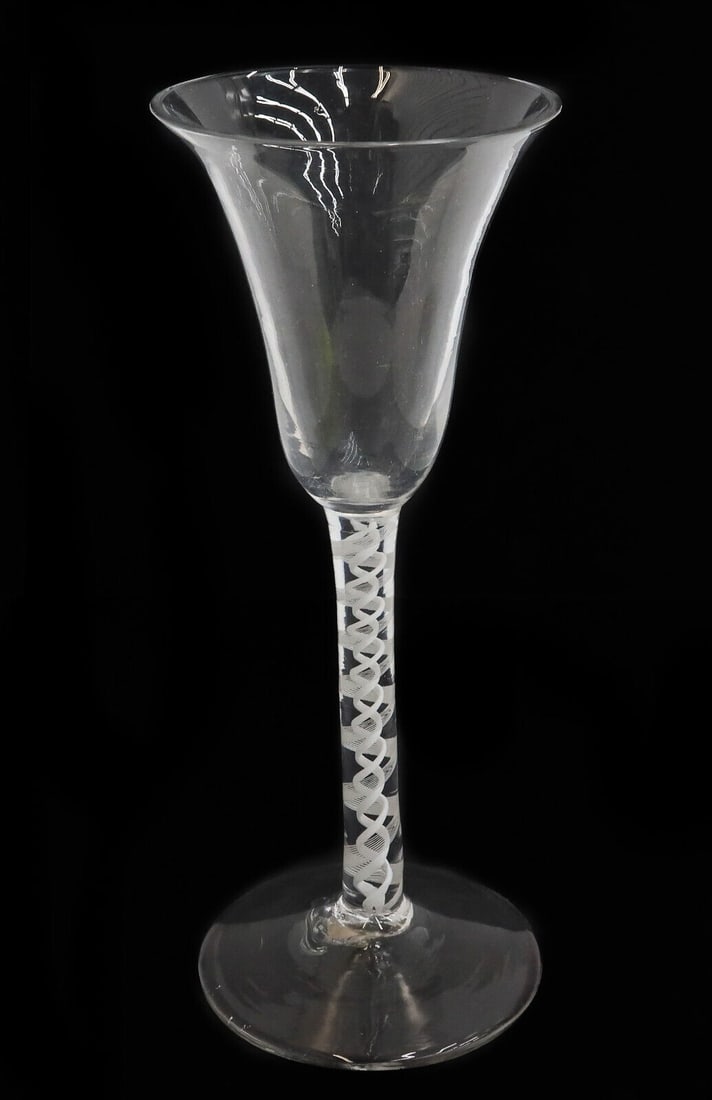 English Georgian Air Twist Glass Wine Glass Goblet, 18th Century: English Georgian Air Twist wine glass goblet, likely 18th century with a rough pontil. White lattice striped air twist decoration to the stem. Weight Approx., 0.25 lb Measures Approx.,2.75 inches diam