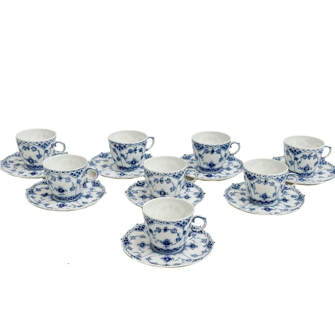 8 Royal Copenhagen Denmark Porcelain Blue Fluted Half Lace Cup & Saucers 1035: 8 Royal Copenhagen Denmark Porcelain Blue Fluted Half Lace Cup & Saucers 1035, circa 1970. Fluted porcelain with a delicate blue floral design. Half lace border. Royal Copenhagen marks to the undersid