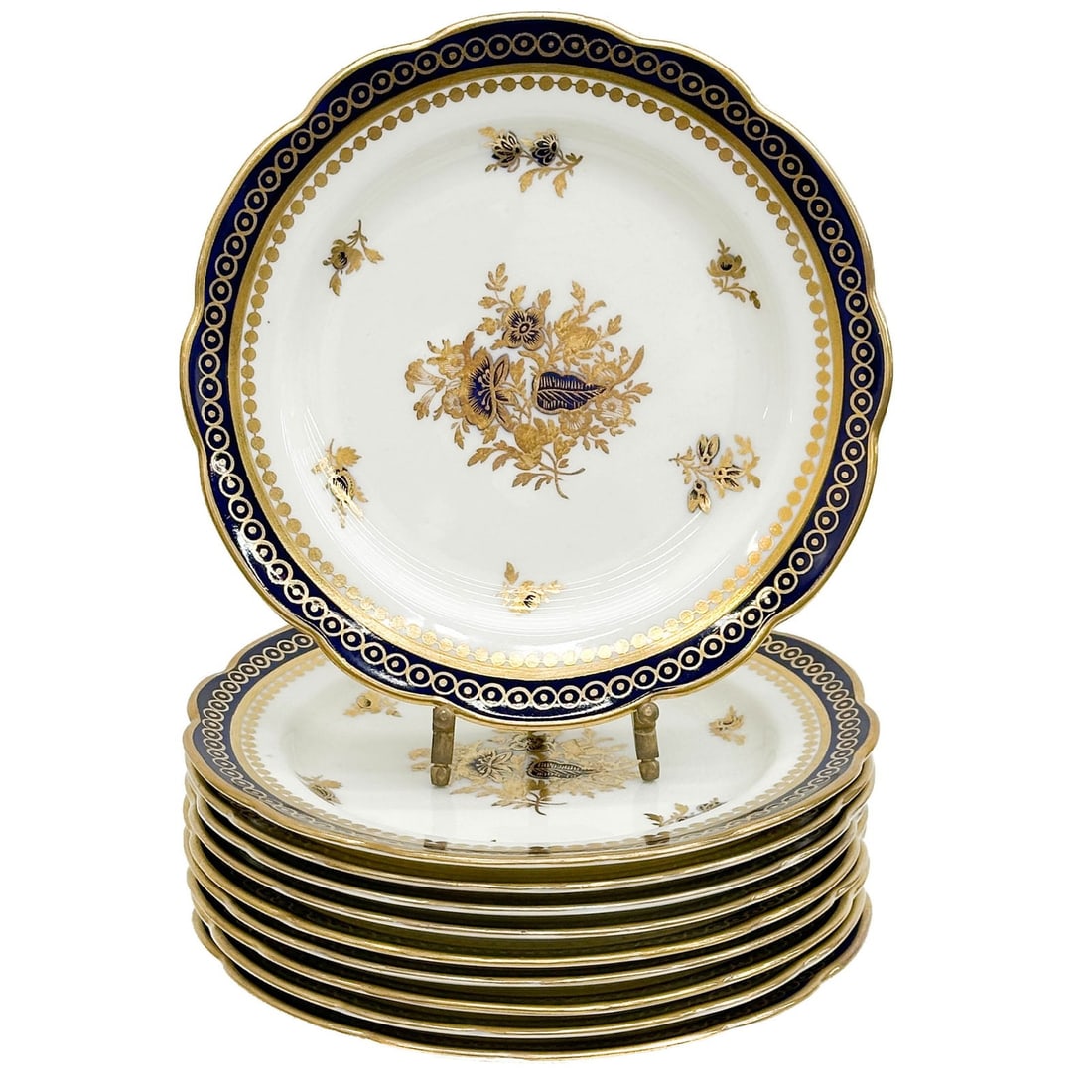 10 Royal Worcester for Tiffany & Co Hand Painted Porcelain Dessert Plates 1900: 10 Royal Worcester for Tiffany & Co Hand Painted Porcelain Dessert Plates, 1900. A cobalt blue ground to the edge, gilt and blue floral decoration to the center. Gilt to the scalloped rim. Underside m