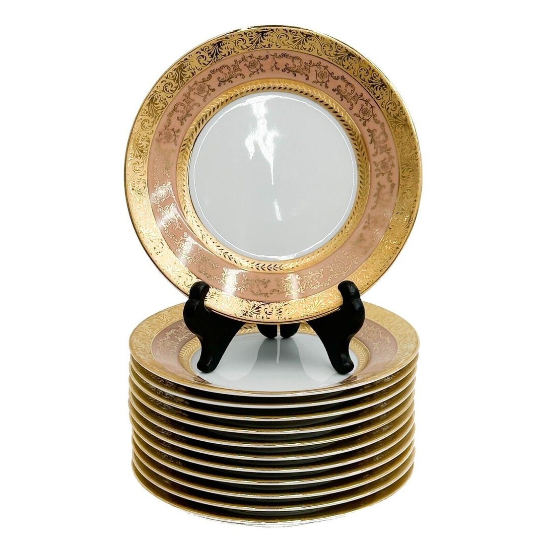 12 Limoges France Ancelin Porcelain Bread or Hors Devours 6 inch Plates: 12 Limoges France Ancelin Porcelain Bread or Hors Devours Plates. A pink ground to the edge, ornate gilt foliate decoration. Underside marked Limoges France ets Ancelin. Weight: Approx. 4 lbs Measurem