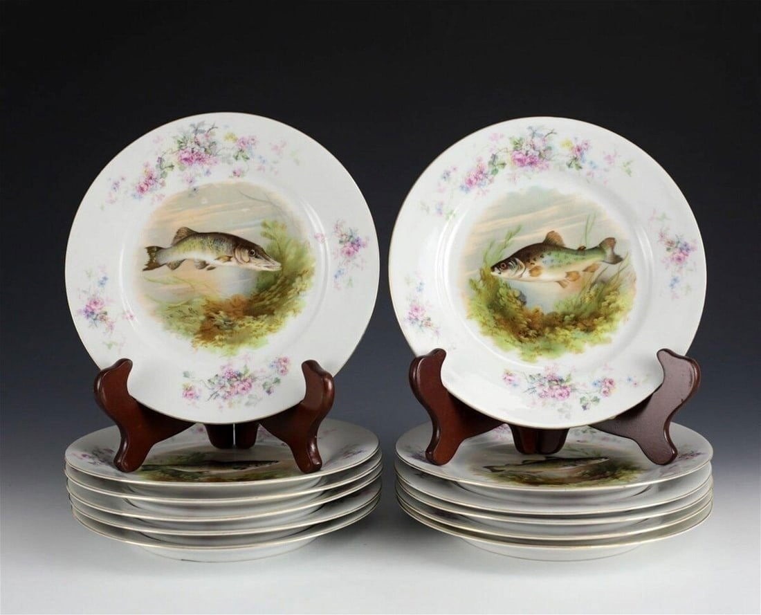 12 Porcelain LS &S Austria Fish Cabinet Plates, c1920.Gilt & Floral Rim: Group of 12 Porcelain LS &S Austria cabinet plates from circa 1920. Gilt rim around the plates with floral accents. The center of the plate has various fish under the sea to the center. Weight Approx.