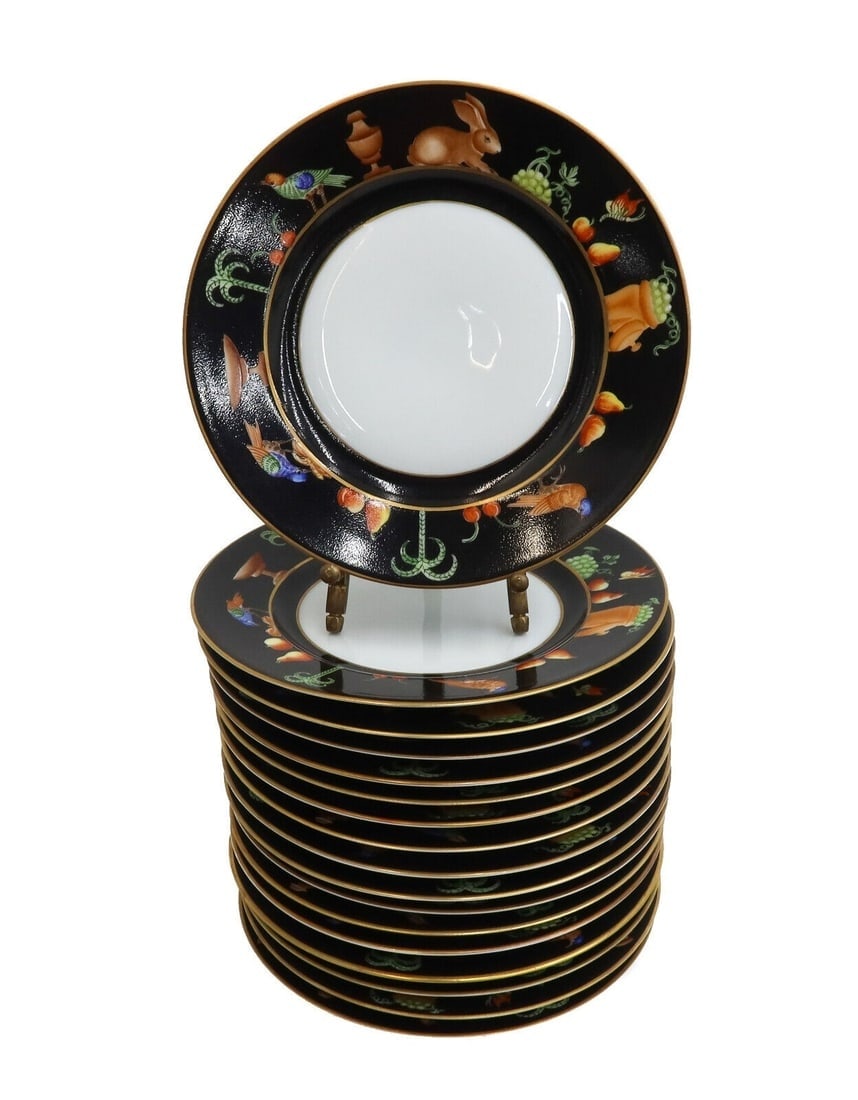 17 Tiffany Le Tallec Private Stock Porcelain Bread Plates in Black Shoulder: 17 Tiffany Le Tallec Private Stock Porcelain Bread or Appetizer Plates in Black Shoulder. A black ground with hand painted rabbits, birds, and fruits around the rim. The plates with a slight coupe cur