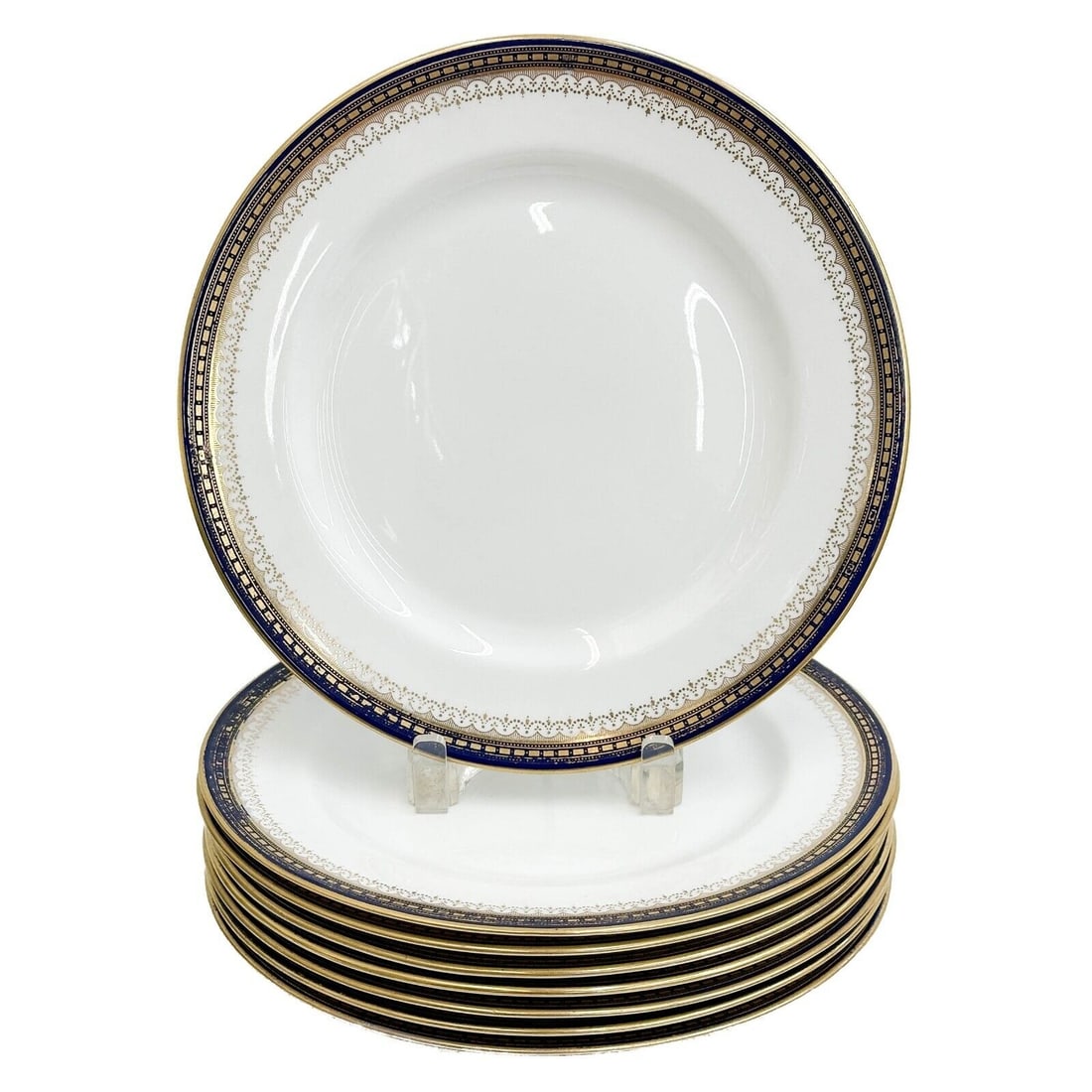 8 Royal Doulton England Gilt Porcelain Dinner Plates circa 1910: 8 Royal Doulton England Gilt Porcelain Dinner Plates, circa 1910. A cobalt blue ground with gilt accents. Underside with Royal Doulton marks, most with Collamore retailer's marks. Weight: Approx. 11.5