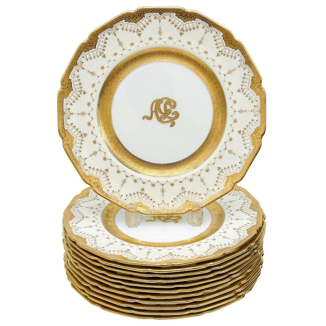 12 Royal Doulton Gilt Porcelain Art Deco Dinner Plates Monogrammed circa 1910: 12 Royal Doulton Gilt Porcelain Art Deco Dinner Plates, circa 1910. A white ground with gilt accents to the edge, gilt art nouveau stylized monogram to the center. Underside with Royal Doulton marks,