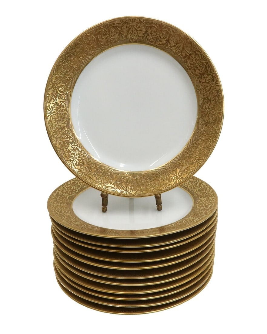 12 Limoges France Porcelain Gilt Rimmed Dessert Plates circa 1940: 12 Limoges France porcelain gilt rimmed dessert plates, circa 1940. Golt encrusted folaite scrolls to rim. Limoges France mark to underside. Weight: Approx. 10 lbs Measurements: Approx. 7.5 inches dia