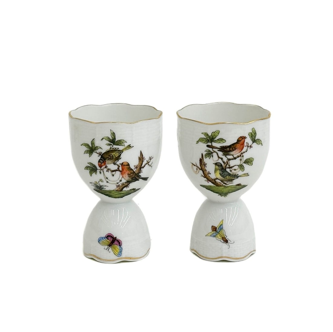 Pair Herend Hungary Rothschild Birds Hand Painted Porcelain Double Egg Cups: Pair Herend Hungary Rothschild Birds Hand Painted Porcelain Double Egg Cups. A white ground with hand painted scenes of birds in trees, basketweave decoration to the edge. Underside with Herend Hungar