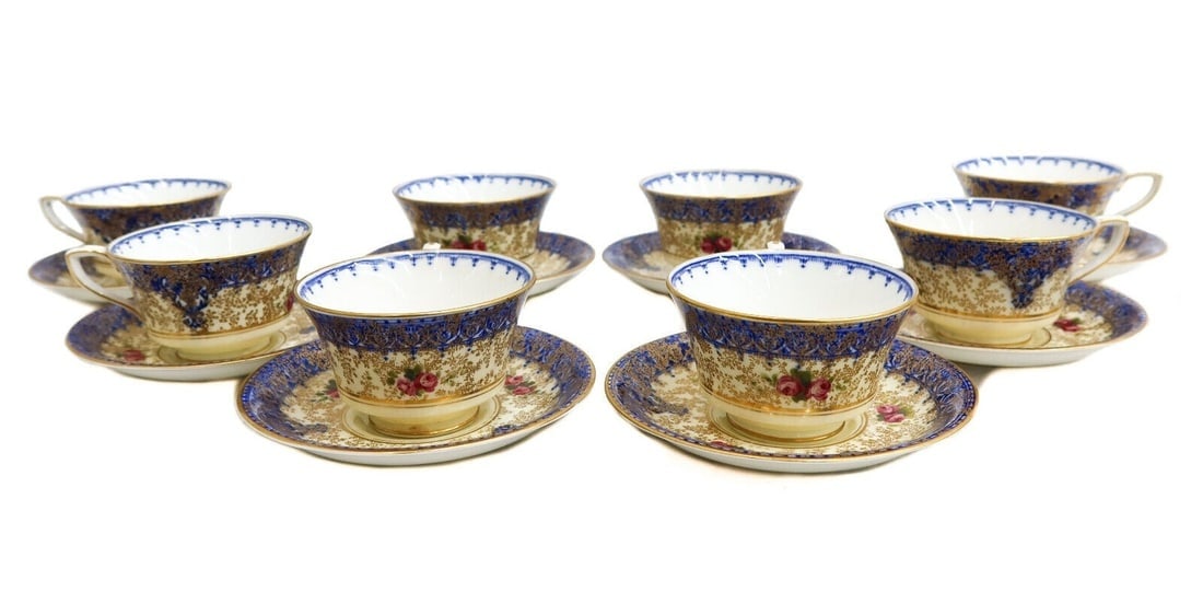 8 Royal Worcester England Hand Painted Porcelain Cup and Saucers 1938: 8 Royal Worcester England Hand Painted Porcelain Cup and Saucers 1938. Peach and cobalt blue ground with hand painted red flowers and gilt accents throughout. Royal Worcester mark to underside, each d