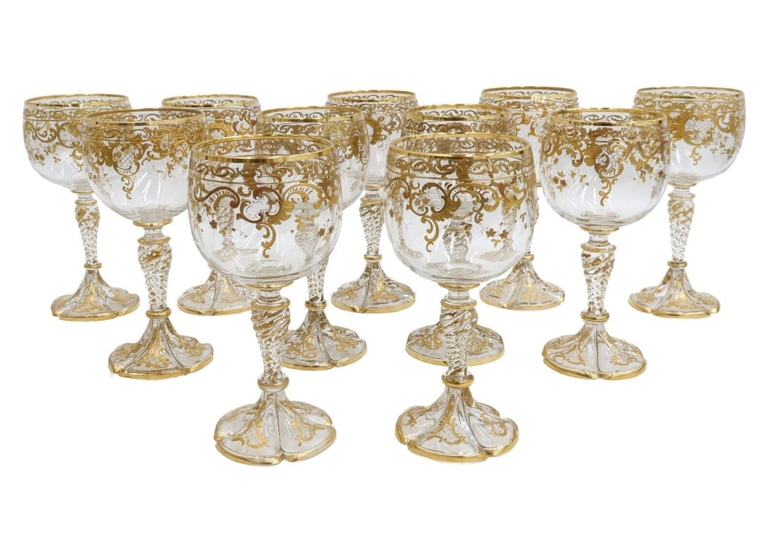 11 Bohemian Cut Glass Gold Encrusted Wine Goblets circa 1930: 11 Bohemian Cut Glass Gold Encrusted Wine Goblets, circa 1930. Gilt encrusted foliate scrolls and florals throughout. Scalloped base. Weight: Approx. 4 lbs Measurements: Approx. 3.25 inches diameter x