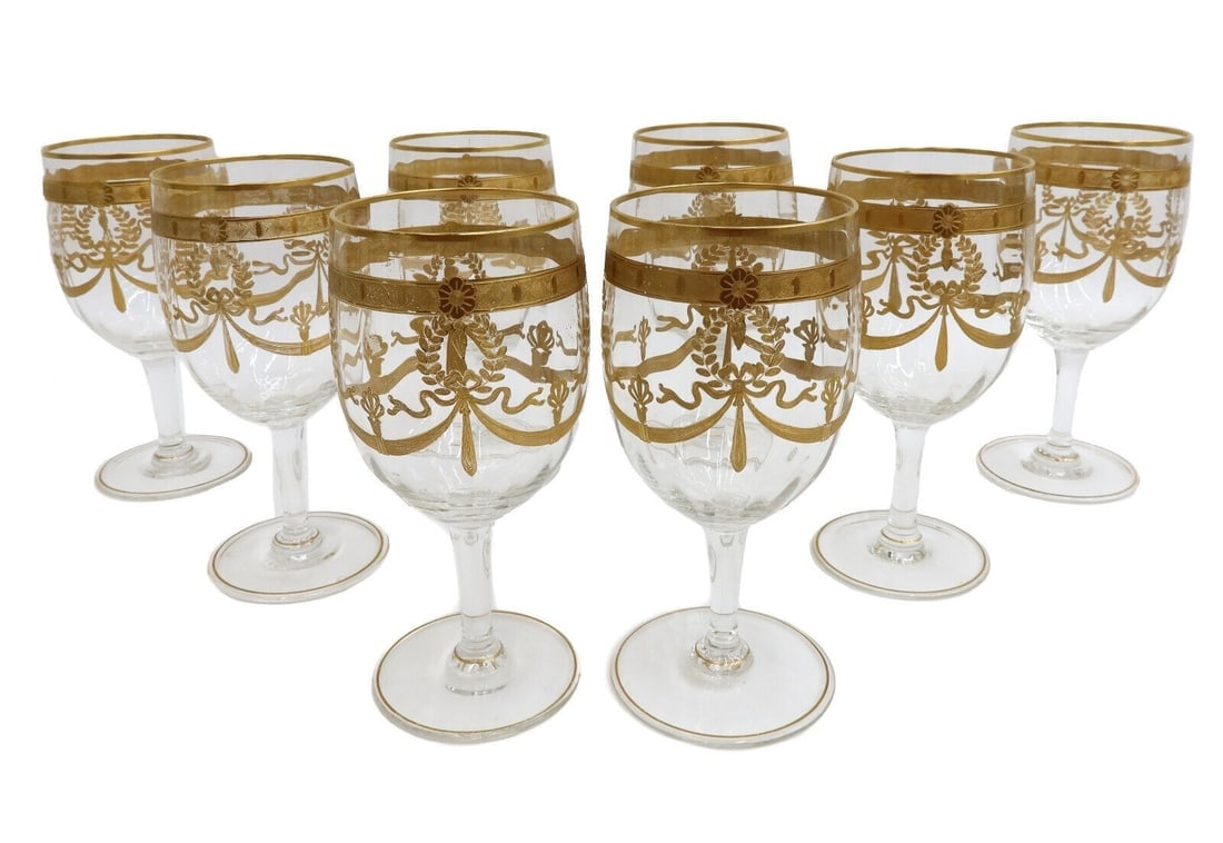 8 Vintage European Glass and Gilt Wine Goblets Swags and Laurel Leaves: 8 Vintage European glass wine goblets. Gilt to base and rim with gilt swags and laurel leaves. Pontil underside. Weight: Approx. 3 lbs Measurements: Approx. 3 inches diameter x 6.25 inches tall Condit