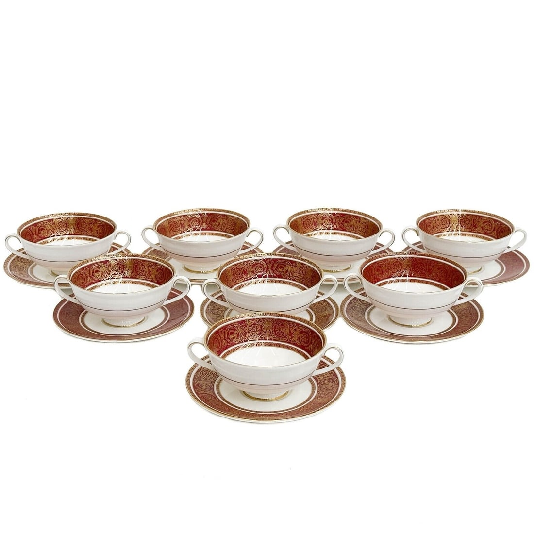 8 Royal Doulton England Porcelain Bouillon Bowls & Underplates in Buckingham Red: 8 Royal Doulton England Porcelain Bouillon Bowls & Underplates in Buckingham, mid century. A maroon ground with ornate gilt foliate decoration. Underside marked Royal Doulton England Buckingham. Weigh