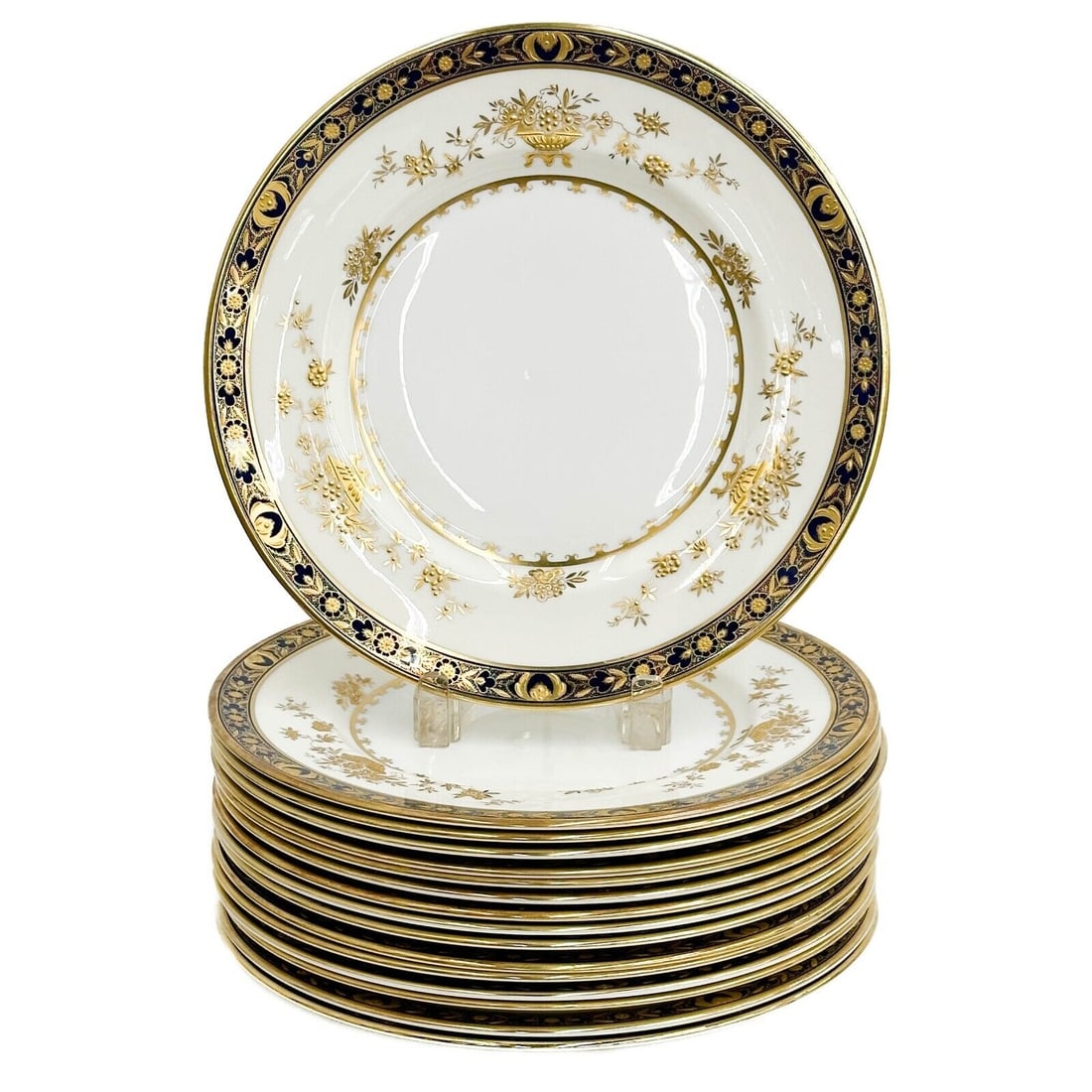 16 Minton England Porcelain Dinner Plates in Dynasty: 16 Minton England Porcelain Dinner Plates in Dynasty. A white ground to the center, cobalt blue to the rim, ornate gilt decoration with urns and florals. Underside marked Minton Dynasty H3775 Weight: