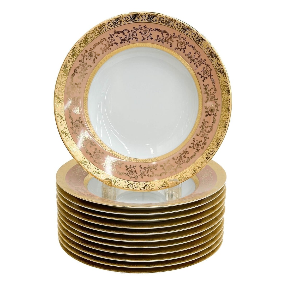 12 Limoges France Ancelin Porcelain Rimmed Soup Bowls: 12 Limoges France Ancelin Porcelain Rimmed Soup Bowls. A pink ground to the edge, ornate gilt foliate decoration. Underside marked Limoges France ets Ancelin. Weight: Approx. 10 lbs Measurements: Appr