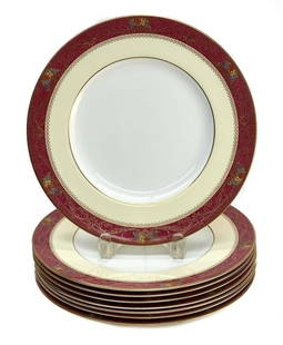 8 Royal Worcester England Porcelain Dinner Plates, 1926. Powdered Burgundy Rim: 8 Royal Worcester England porcelain dinner plates, 1926. A powdered burgundy red ground with a peach inner rim. Multi-colored enamel floral bouquets to the edge. Royal Worcester mark to the underside