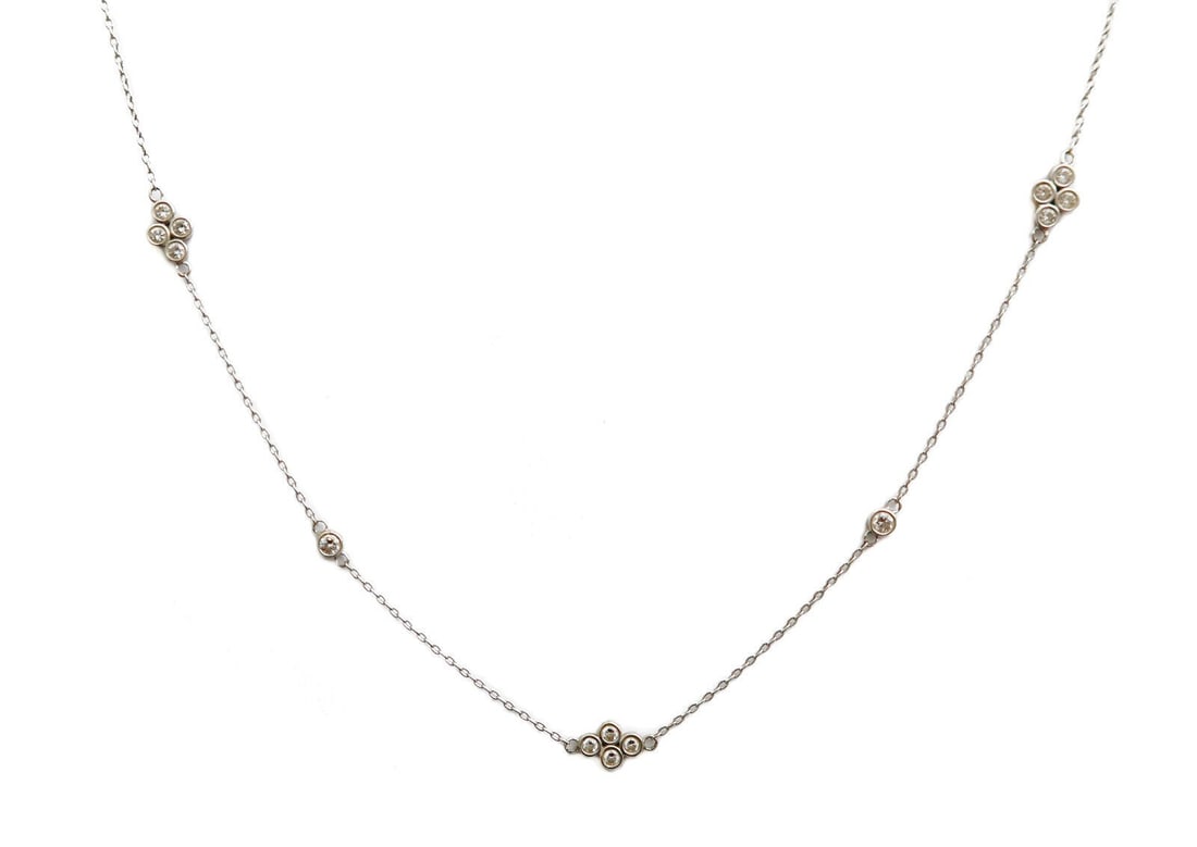 Kwiat 18k White Gold and Diamond Quad Necklace, 29 inches: Kwiat 18k white gold and diamond quad necklace, 29 inches. Clusters of 4 diamonds alternating with single diamonds weighing approximately 0.71 carats total. Kwiat 18k marks to clasp.Weight Approx., 4.